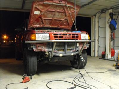 tack it into the crossmember and tack on the main